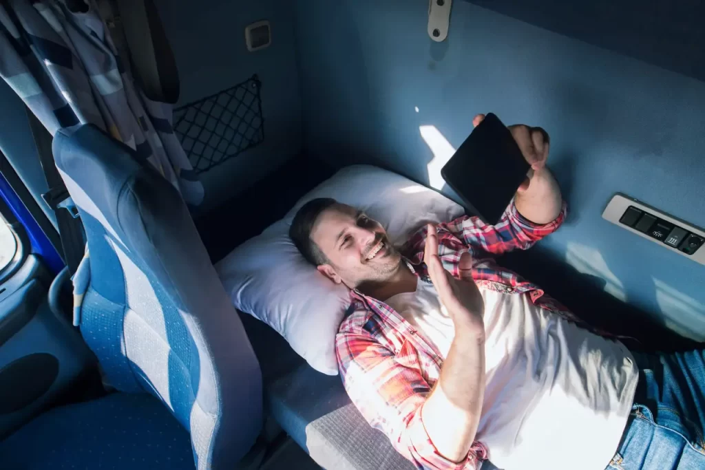 truck driver lying in the truck cab