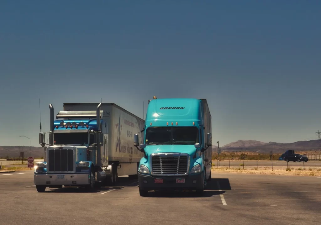 two trucks in a dedicated truck parking area