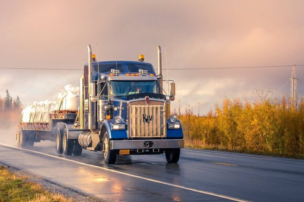 semi truck driving along a highway