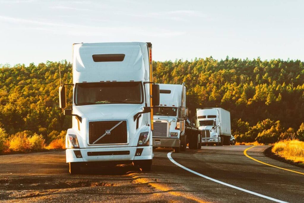 semi trucks parked on the side of the road