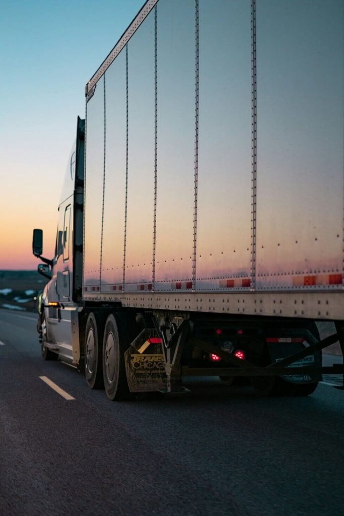 trailer truck driving on a road