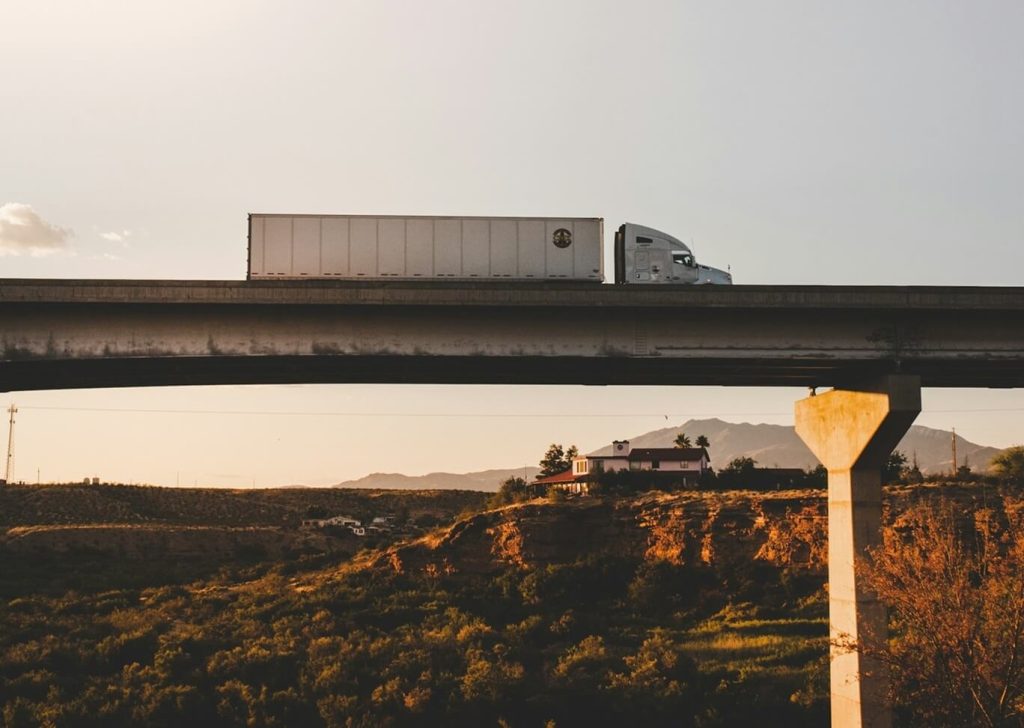 semi truck on the road during summer