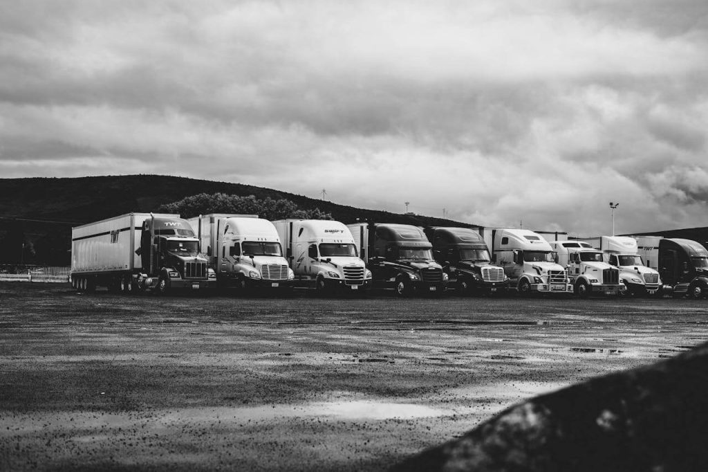 semi trucks parked in a row