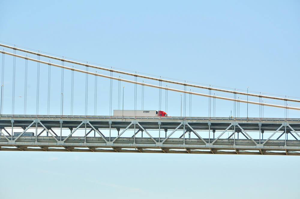 truck driving on a bridge