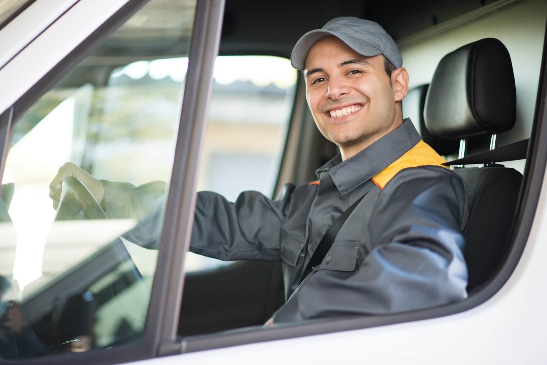 happy truck driver in a truck