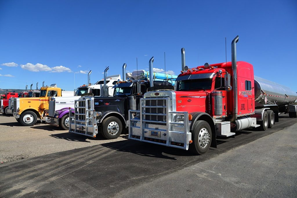 semi trucks parked in a row