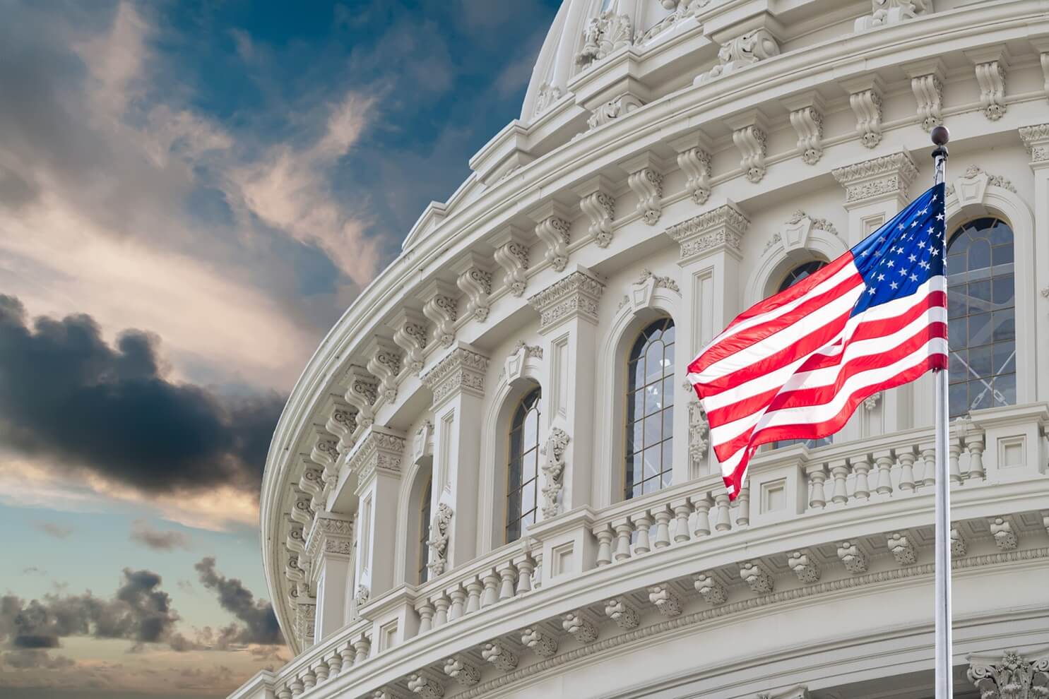 us flag in front of the capitol building