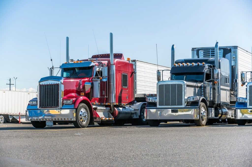 classic rigs parked at a truck parking lot